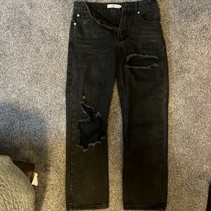 Women’s extra am Adika distressed, ripped black jeans. Ankle length.